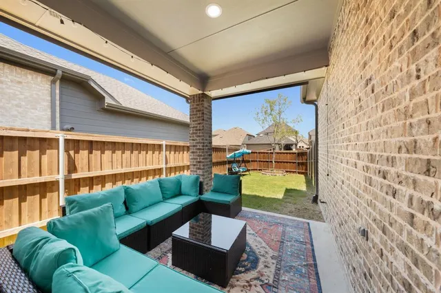 a living room with a couch and a table