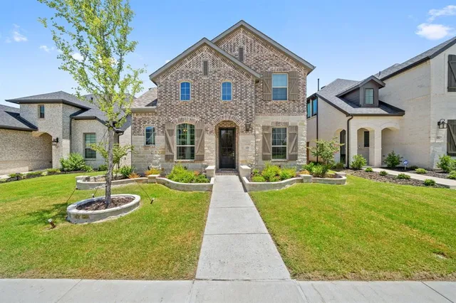 a front view of a house with swimming pool having outdoor seating