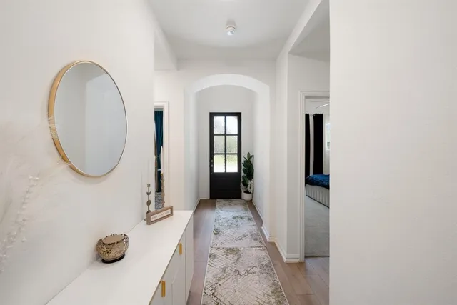 a view of a livingroom with furniture and entryway