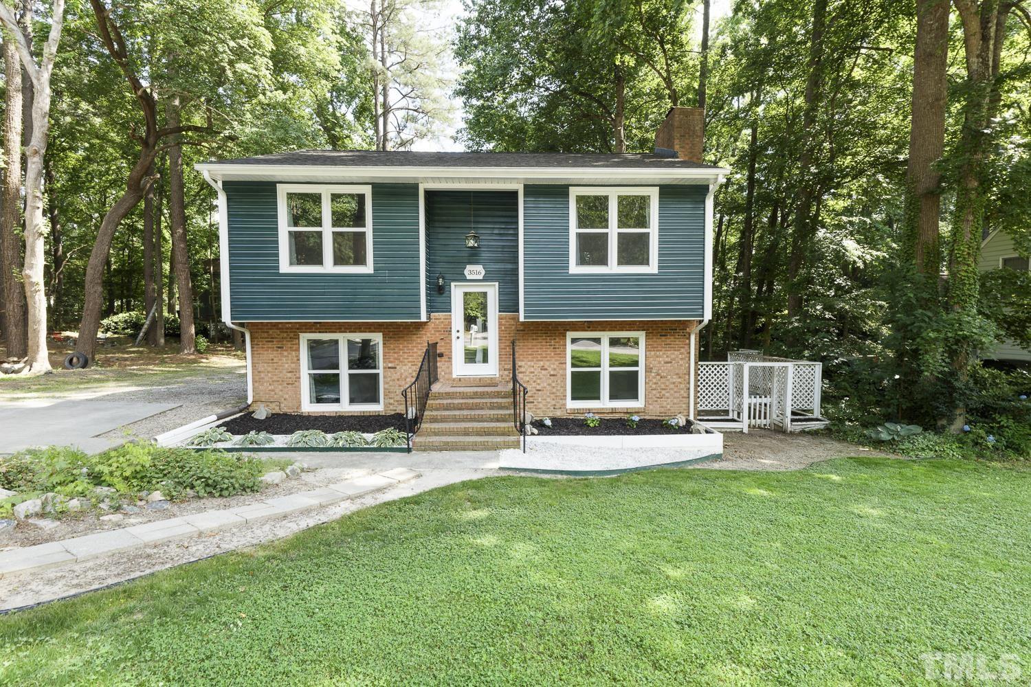3516 Donna Road Raleigh, NC 27604 - Photo 1 of 41 a front view of a house with a yard and porch