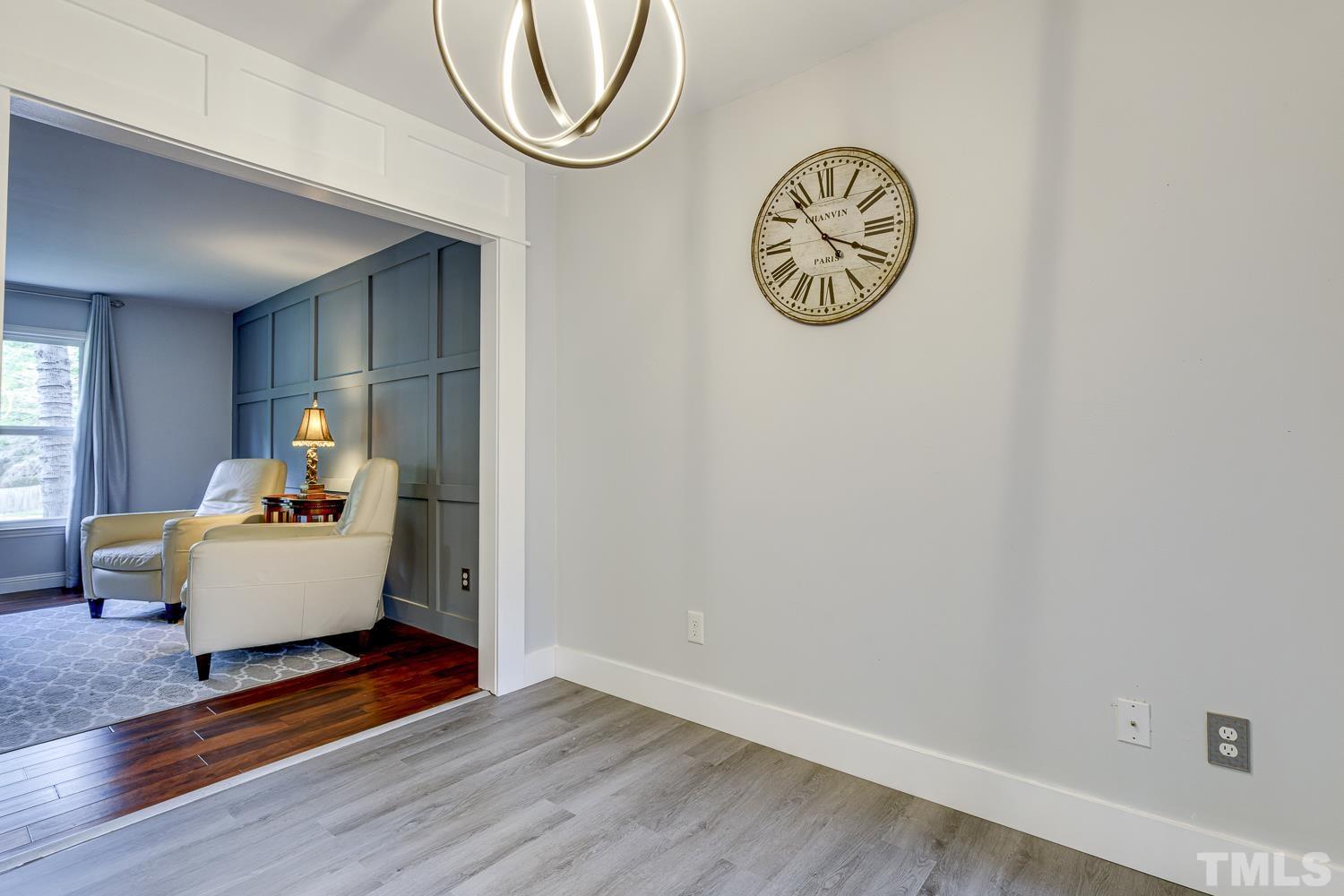 3516 Donna Road Raleigh, NC 27604 - Photo 15 of 41 a living room with wooden floor and a table