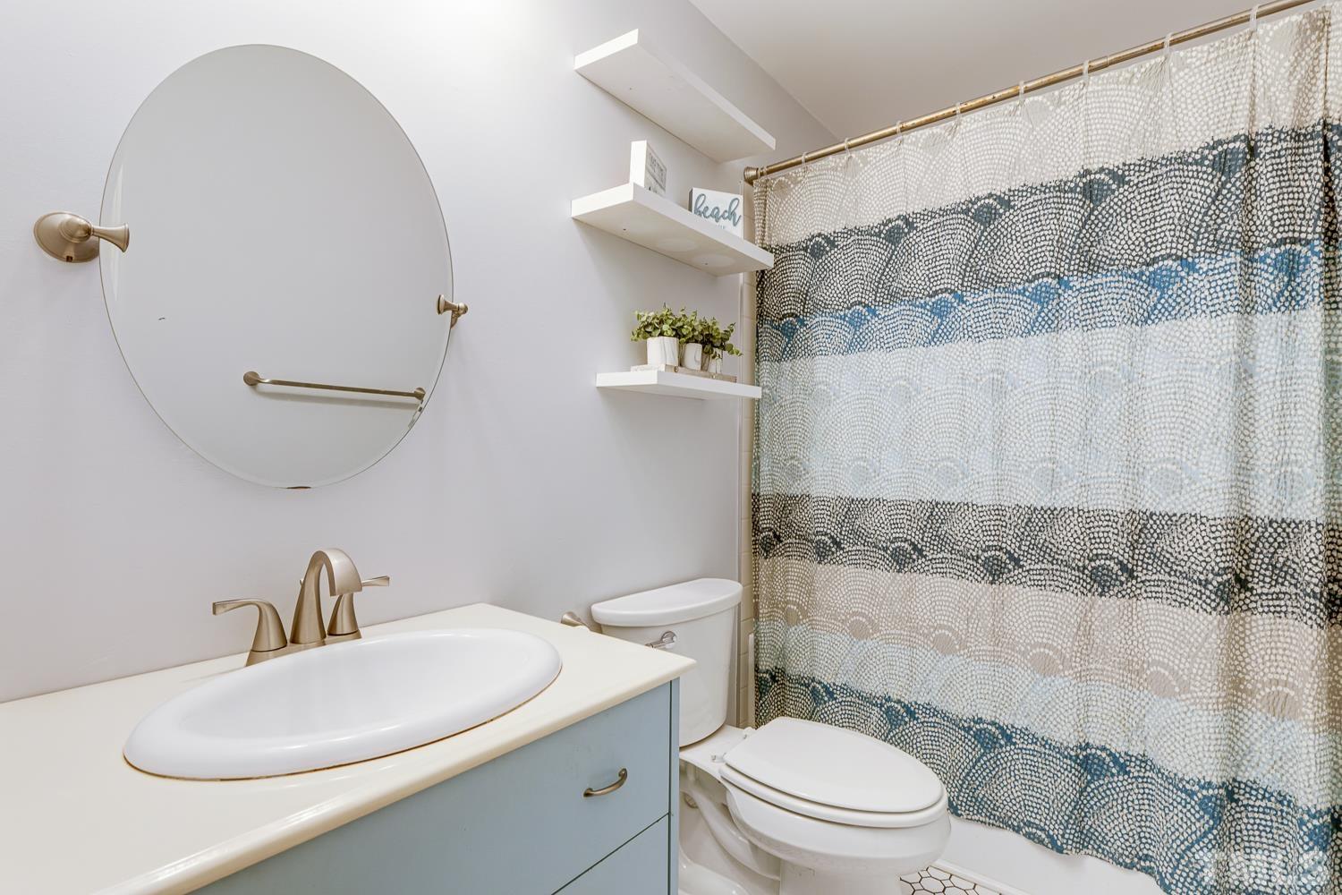 3516 Donna Road Raleigh, NC 27604 - Photo 21 of 41 a bathroom with a sink a toilet and shower