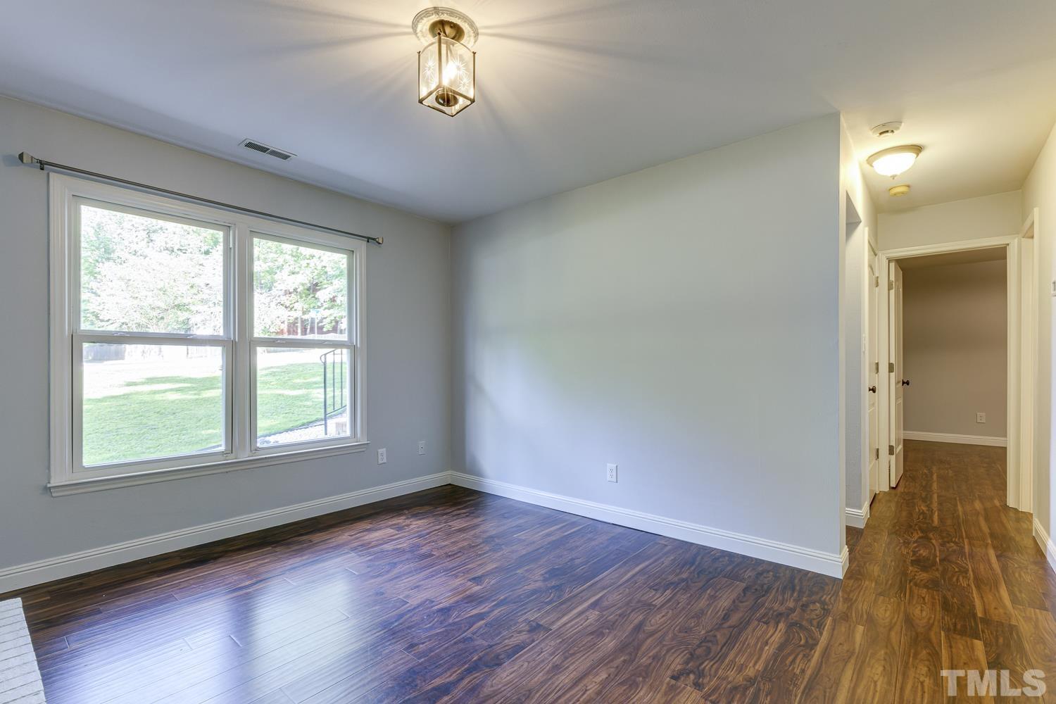 3516 Donna Road Raleigh, NC 27604 - Photo 25 of 41 an empty room with wooden floor and windows