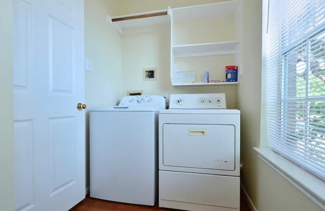 a utility room with dryer and washer