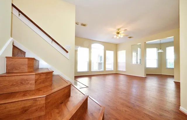 a view of an entryway with wooden floor