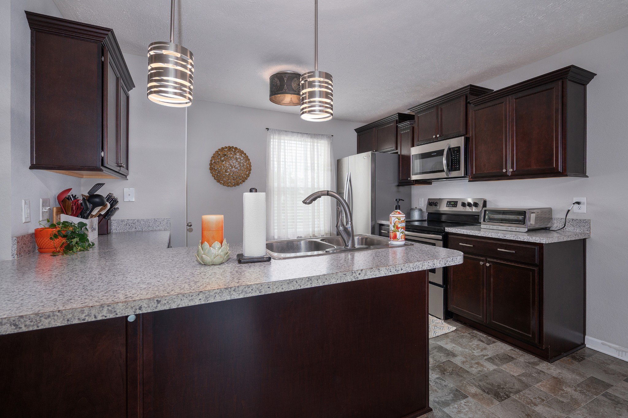 118 Ramsden Avenue La Vergne, TN 37086 - Photo 13 of 33 a kitchen with stainless steel appliances granite countertop a sink dishwasher a stove and a microwave oven on granite countertops