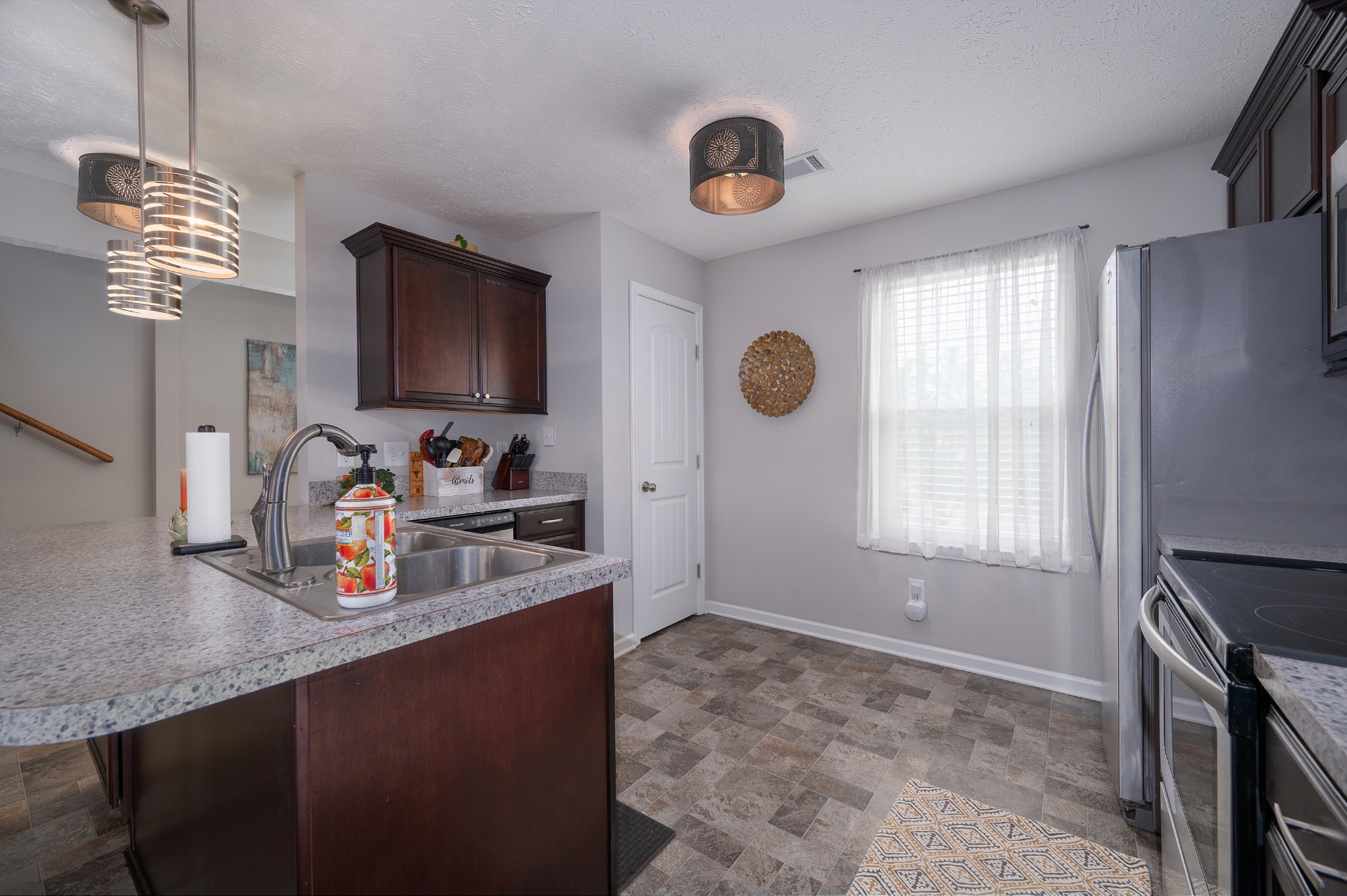 118 Ramsden Avenue La Vergne, TN 37086 - Photo 14 of 33 a kitchen with stainless steel appliances granite countertop a sink stove and refrigerator
