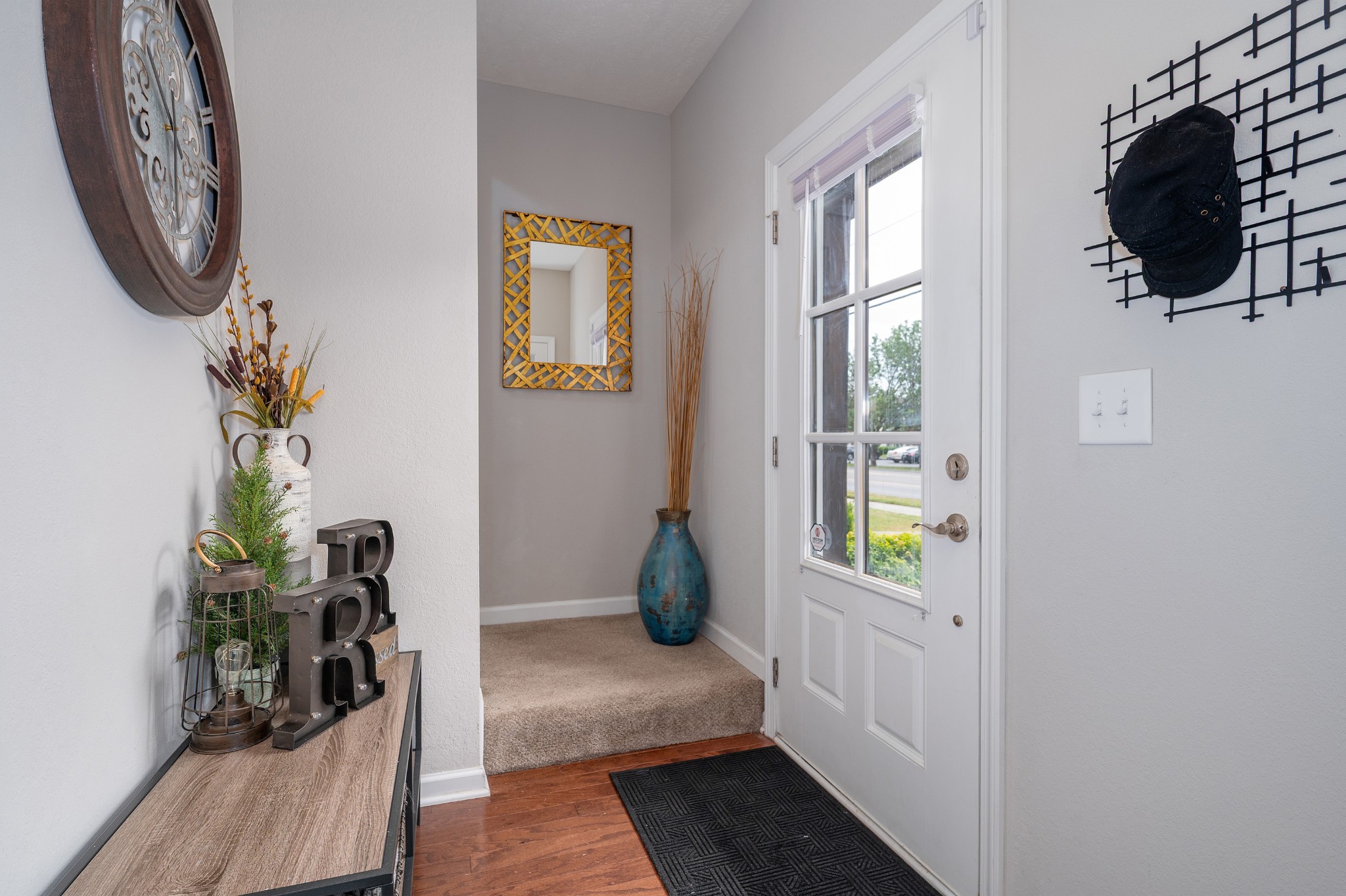 118 Ramsden Avenue La Vergne, TN 37086 - Photo 2 of 33 a hallway with painting on the wall and a potted plant