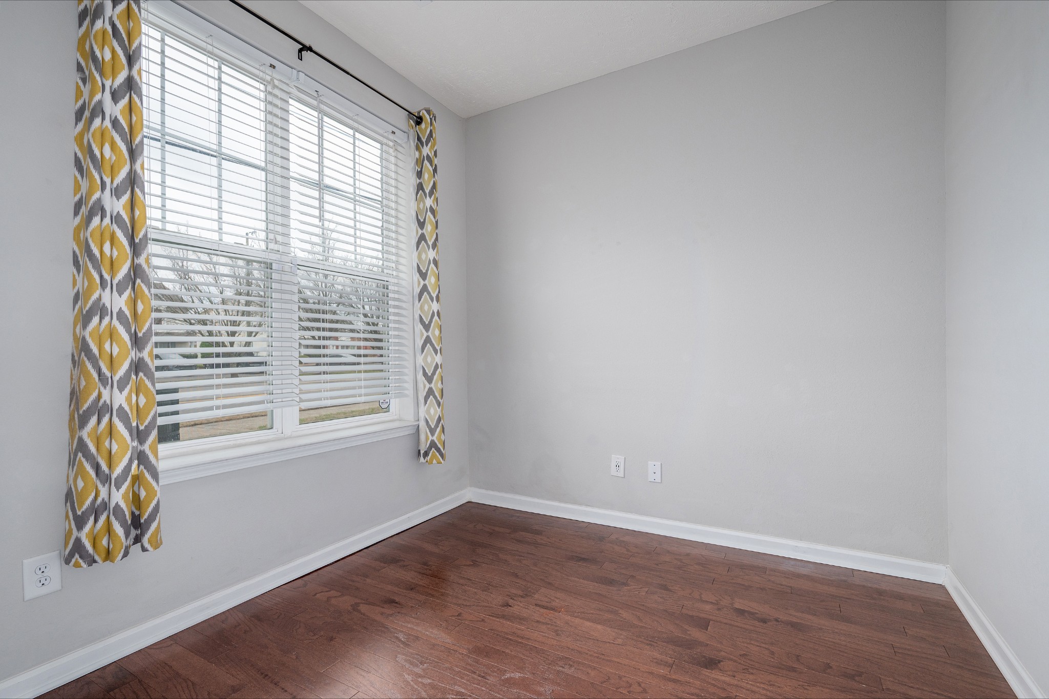 118 Ramsden Avenue La Vergne, TN 37086 - Photo 2 of 24 an empty room with wooden floor and windows