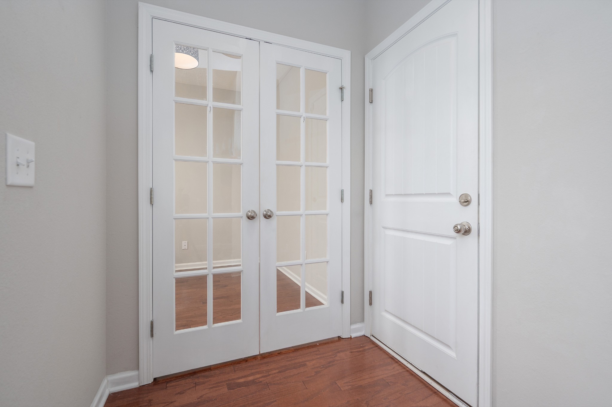 118 Ramsden Avenue La Vergne, TN 37086 - Photo 3 of 24 a view of an empty room with wooden floor and a window