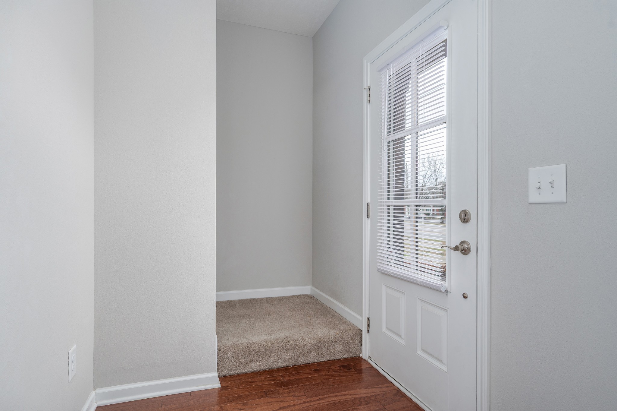 118 Ramsden Avenue La Vergne, TN 37086 - Photo 4 of 24 a view of an empty room with wooden floor and a window