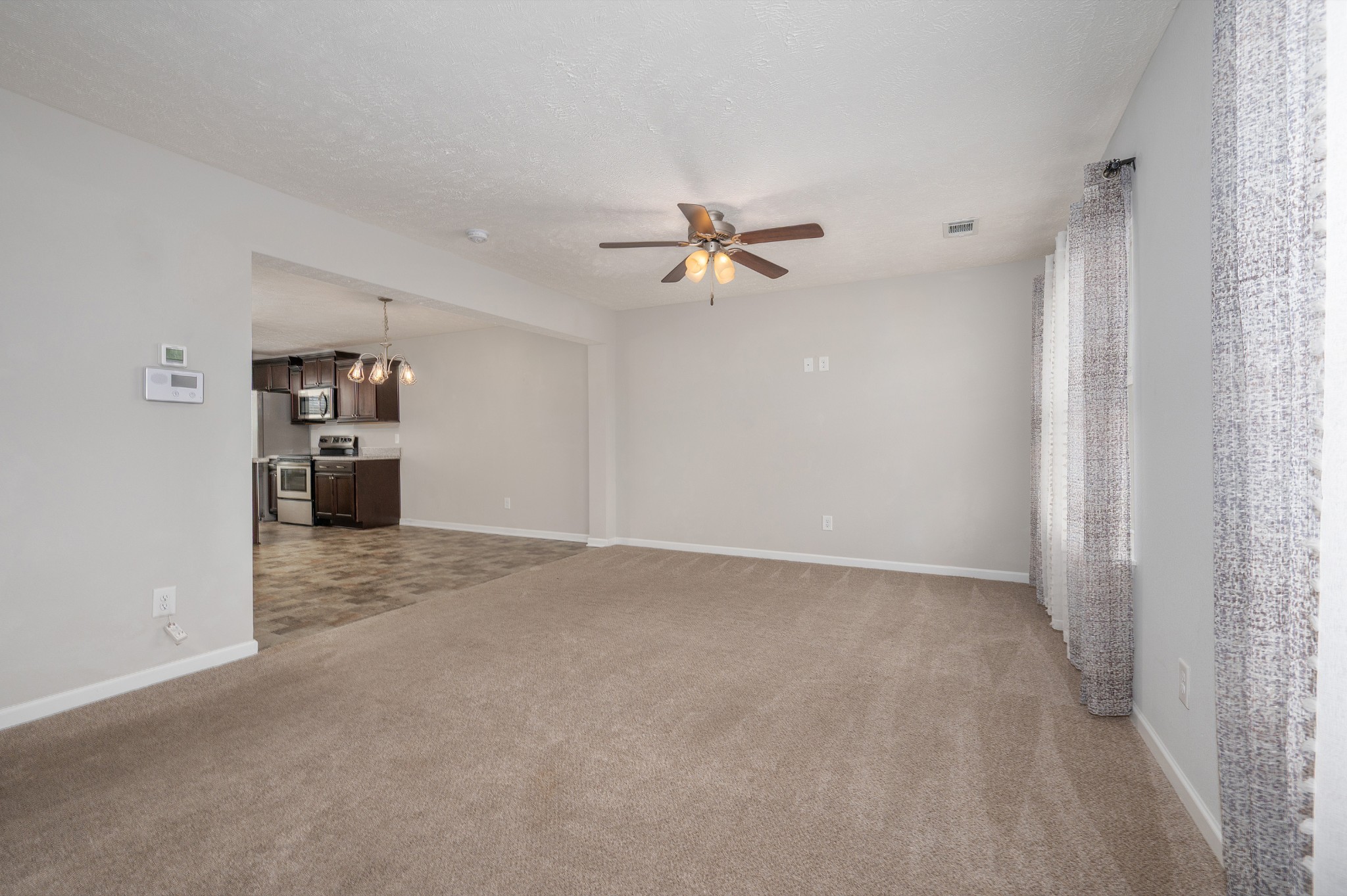 118 Ramsden Avenue La Vergne, TN 37086 - Photo 6 of 24 a view of a livingroom with a chandelier fan and a window