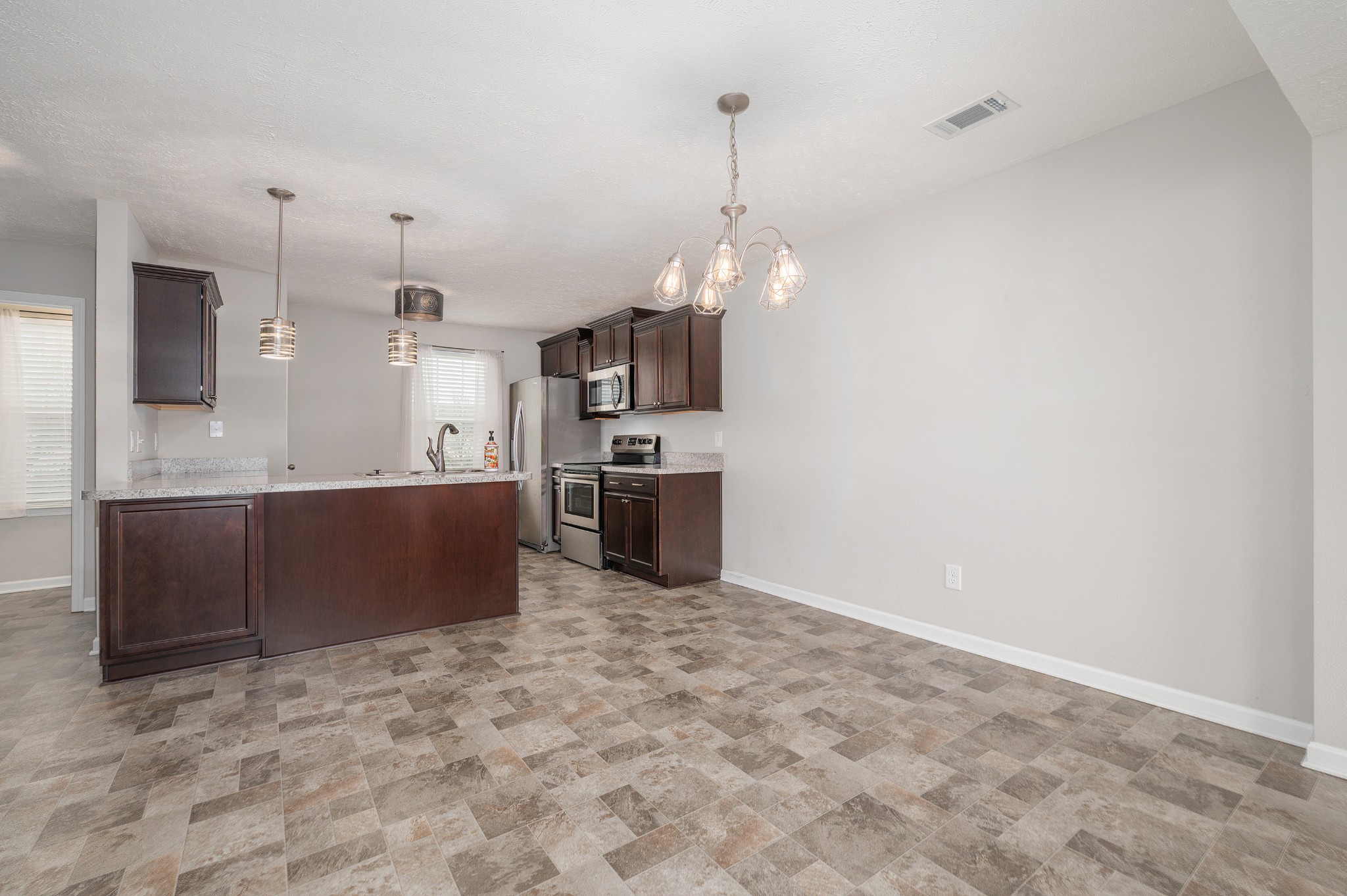 118 Ramsden Avenue La Vergne, TN 37086 - Photo 7 of 24 a large kitchen with cabinets and stainless steel appliances
