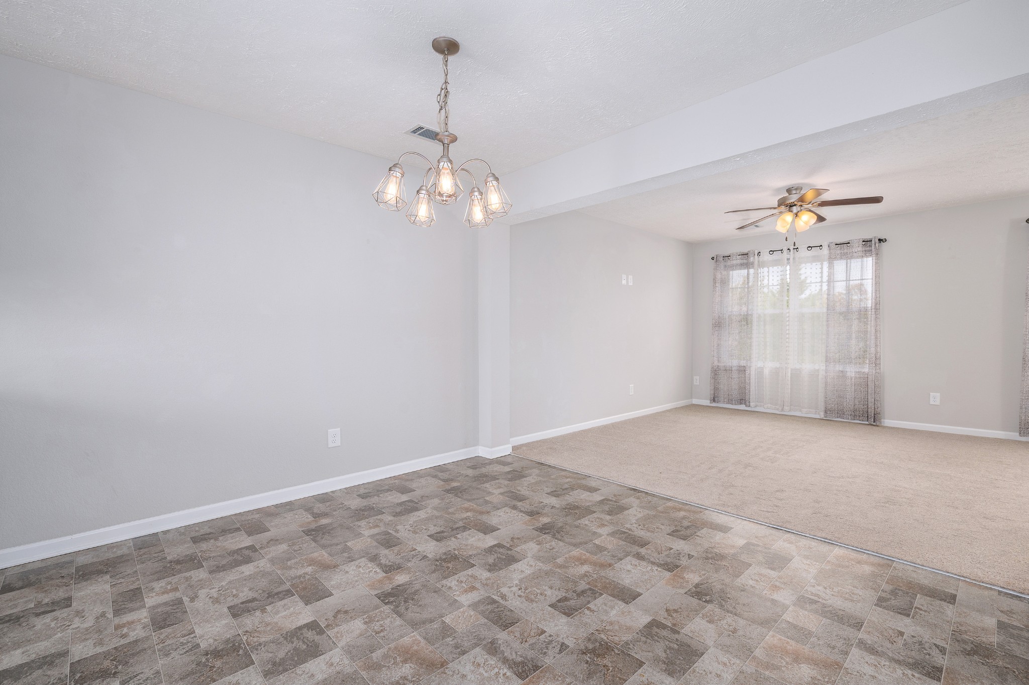 118 Ramsden Avenue La Vergne, TN 37086 - Photo 9 of 24 a view of an empty room with a chandelier fan