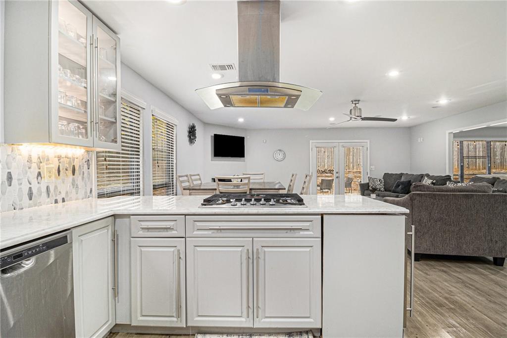 3211 Olde Dekalb Way Atlanta, GA 30340 - Photo 13 of 38 a kitchen with kitchen island granite countertop a sink and white cabinets