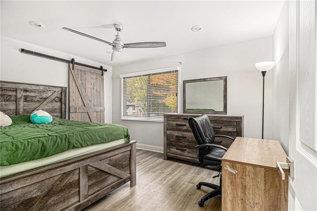 3211 Olde Dekalb Way Atlanta, GA 30340 - Photo 19 of 38 a living room with a bed furniture and a window