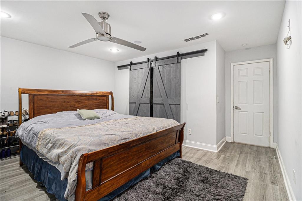 3211 Olde Dekalb Way Atlanta, GA 30340 - Photo 25 of 38 a bedroom with a bed and a dresser