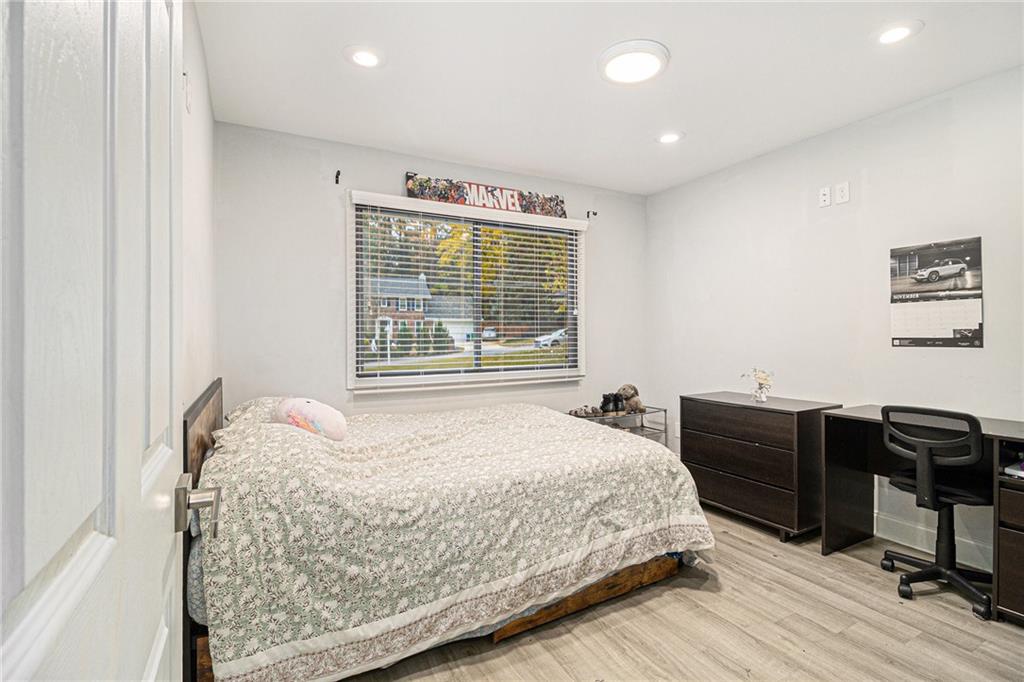 3211 Olde Dekalb Way Atlanta, GA 30340 - Photo 27 of 38 a bedroom with a bed and a desk