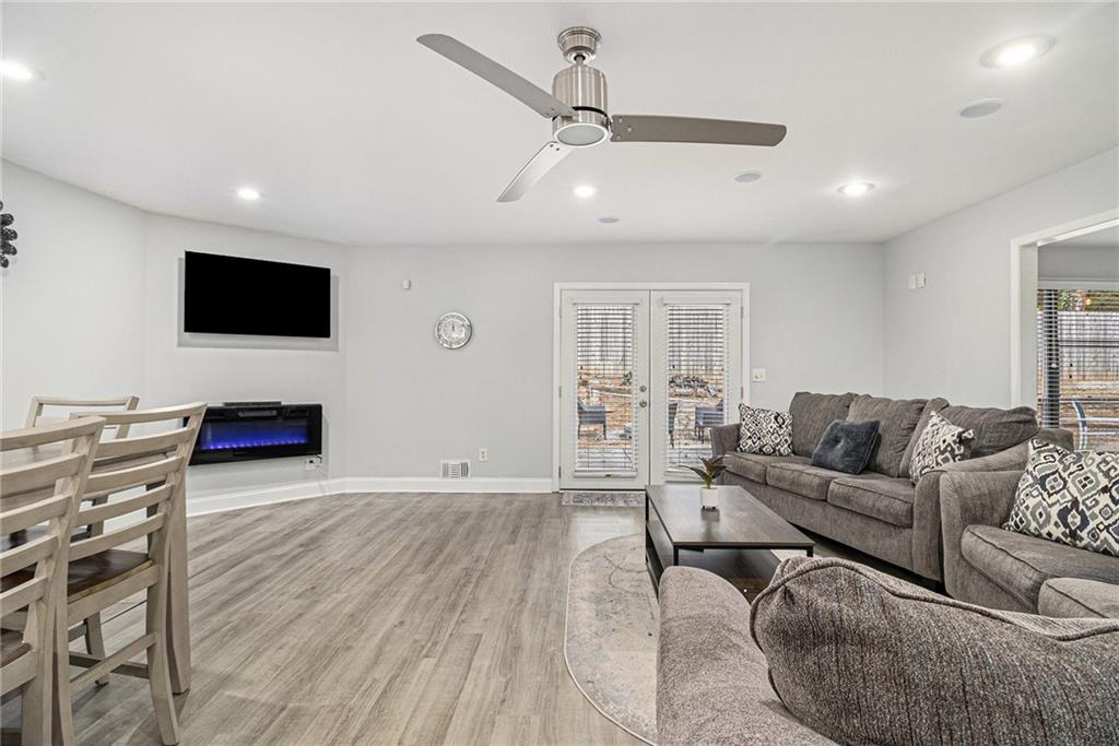 3211 Olde Dekalb Way Atlanta, GA 30340 - Photo 8 of 38 a living room with furniture and a flat screen tv