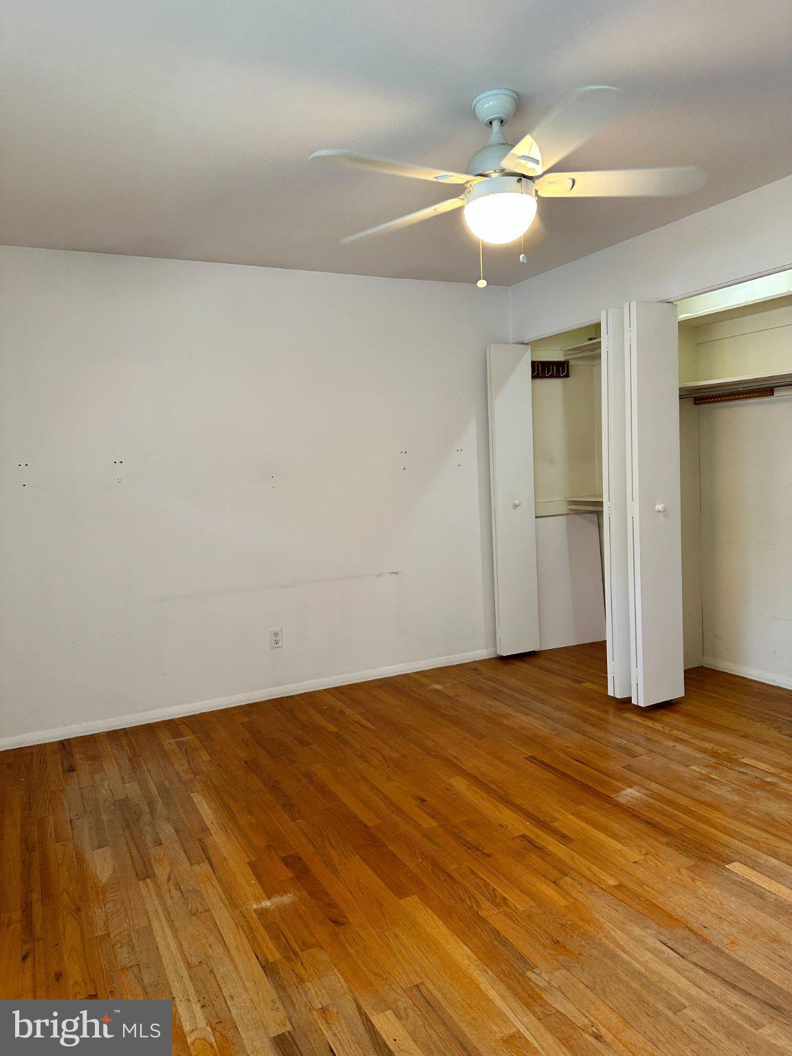 8336 Scotts Level Road Baltimore, MD 21208 - Photo 28 of 55 Bright and airy room with hardwood floors.