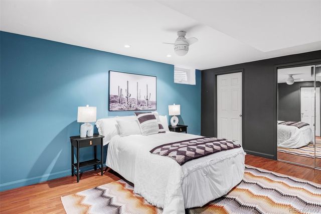 a bedroom with a bed and a lamp