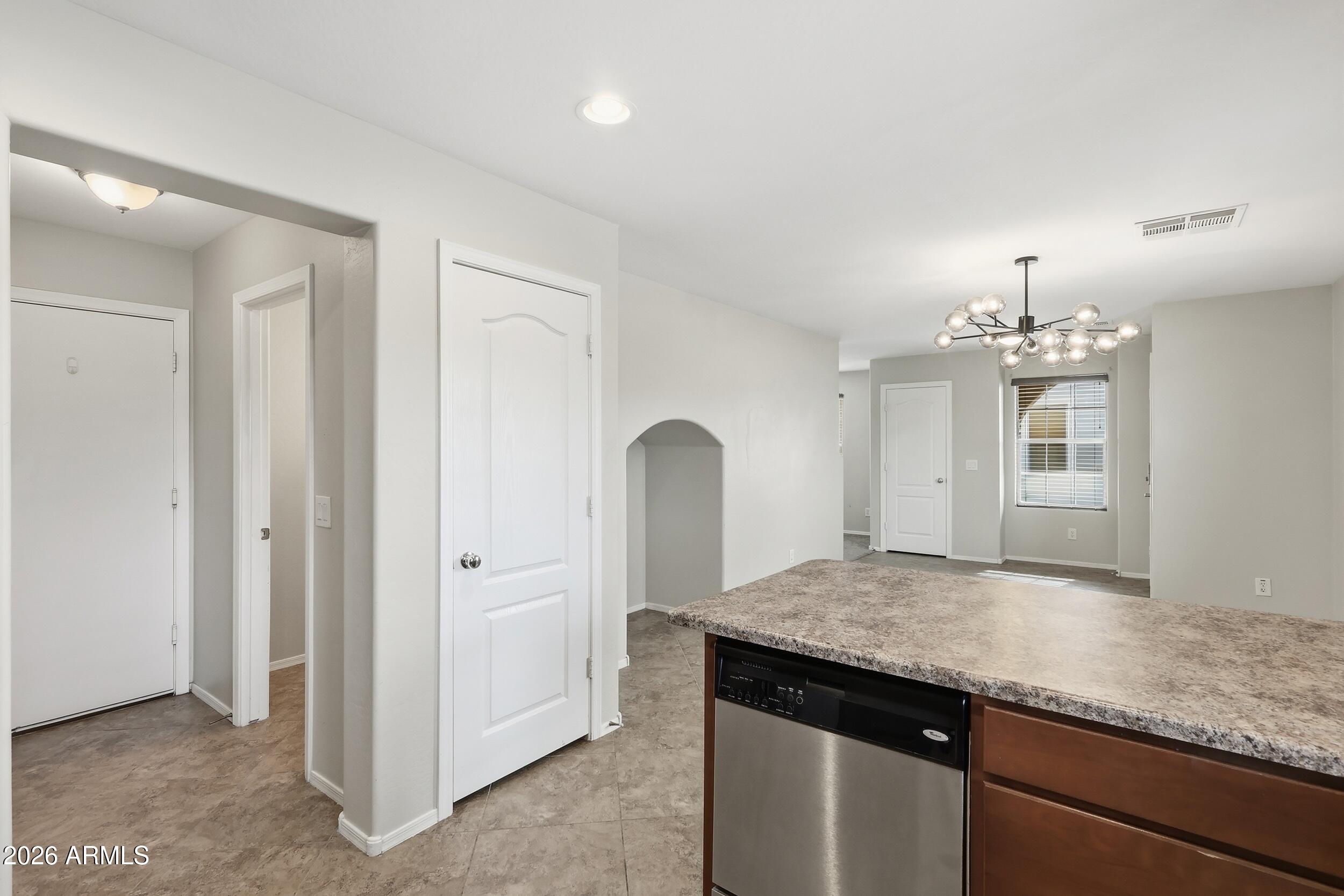 1853 South Balboa Drive Gilbert, AZ 85295 - Photo 11 of 32 a kitchen with a sink and chandelier