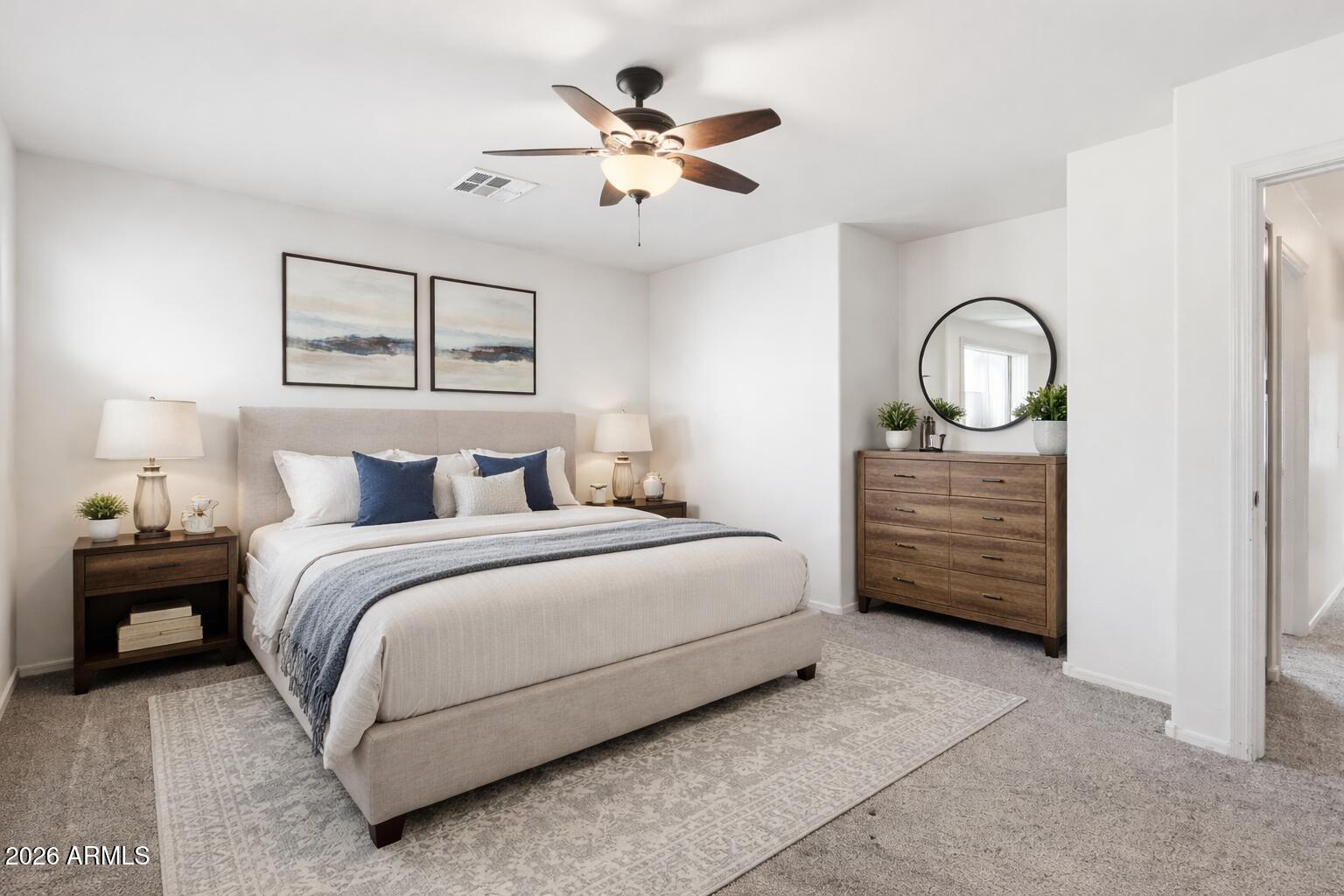 1853 South Balboa Drive Gilbert, AZ 85295 - Photo 17 of 32 a bedroom with a bed and a ceiling fan