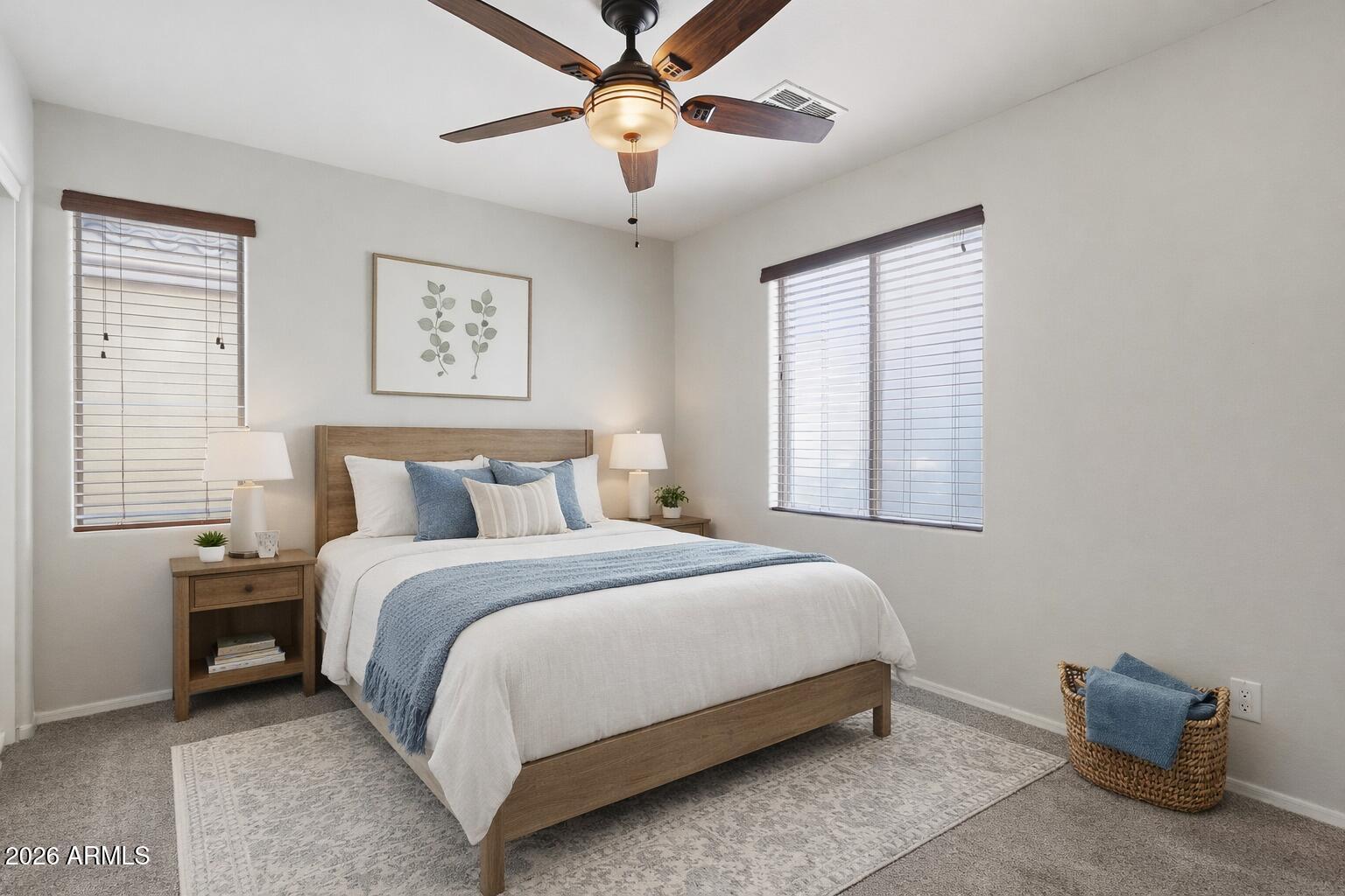 1853 South Balboa Drive Gilbert, AZ 85295 - Photo 22 of 32 a bedroom with a bed and a chandelier