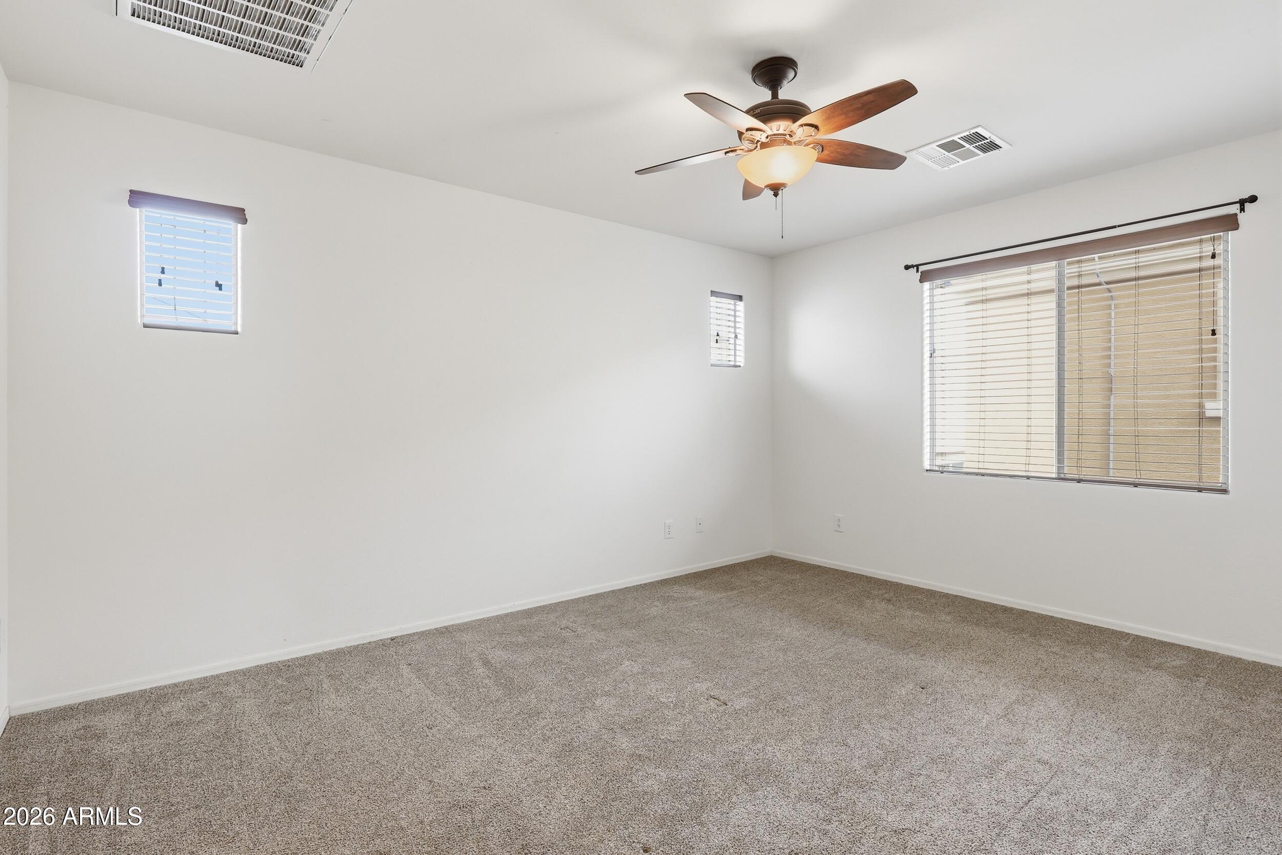 1853 South Balboa Drive Gilbert, AZ 85295 - Photo 26 of 32 an empty room with closet and ceiling fan