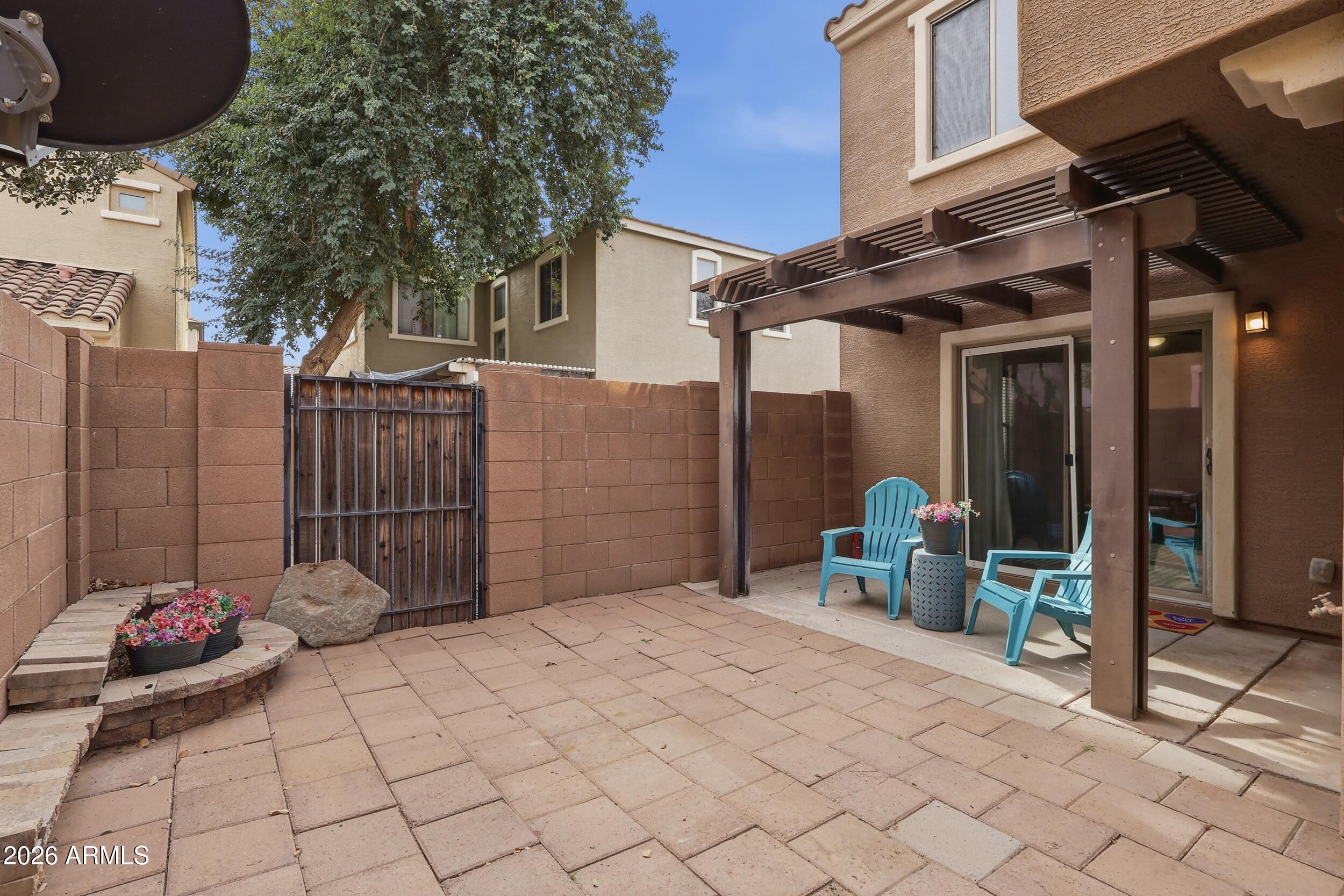 1853 South Balboa Drive Gilbert, AZ 85295 - Photo 30 of 32 a view of a chair and table in backyard of the house
