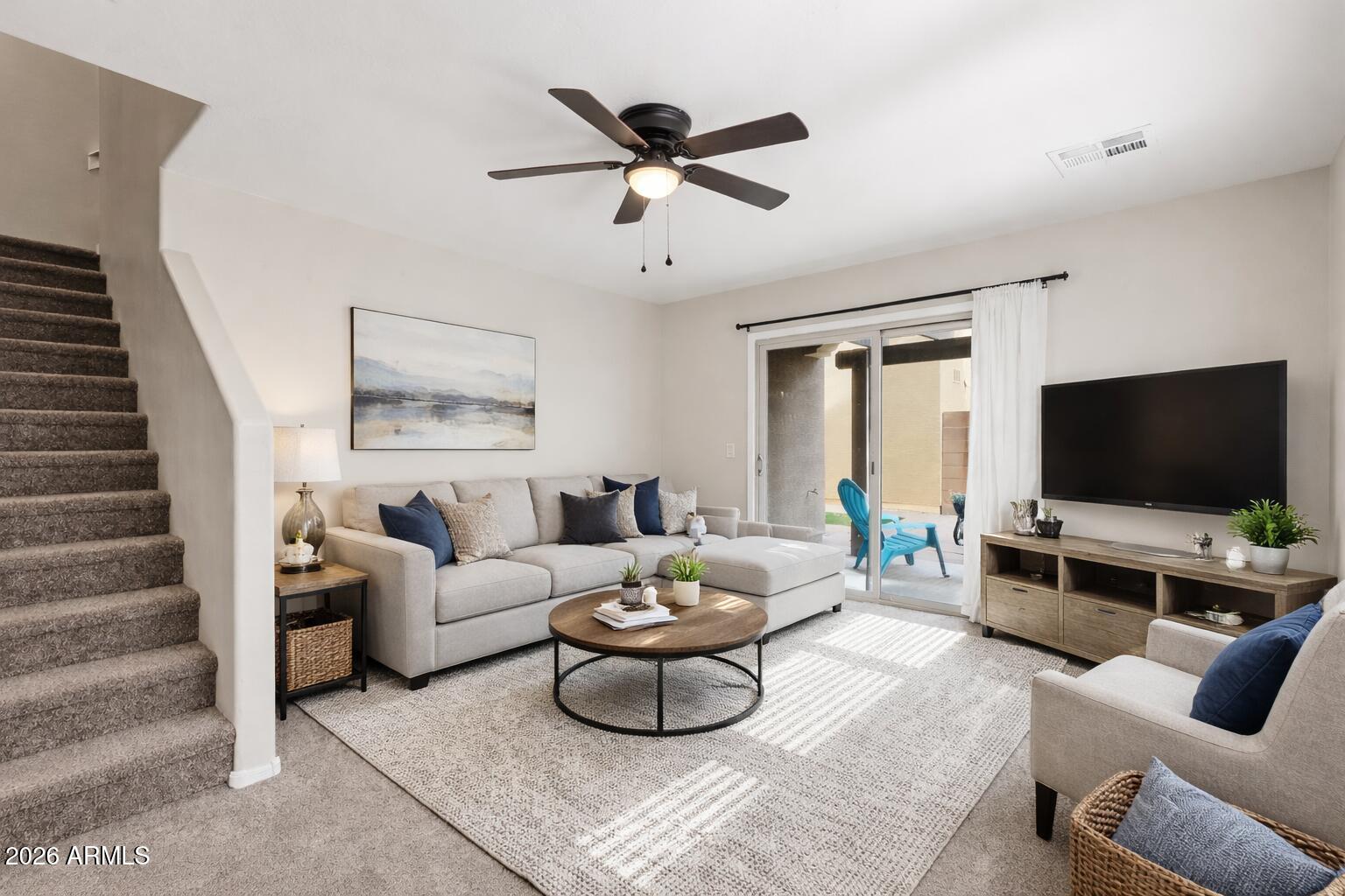 1853 South Balboa Drive Gilbert, AZ 85295 - Photo 3 of 32 a living room with furniture and a flat screen tv