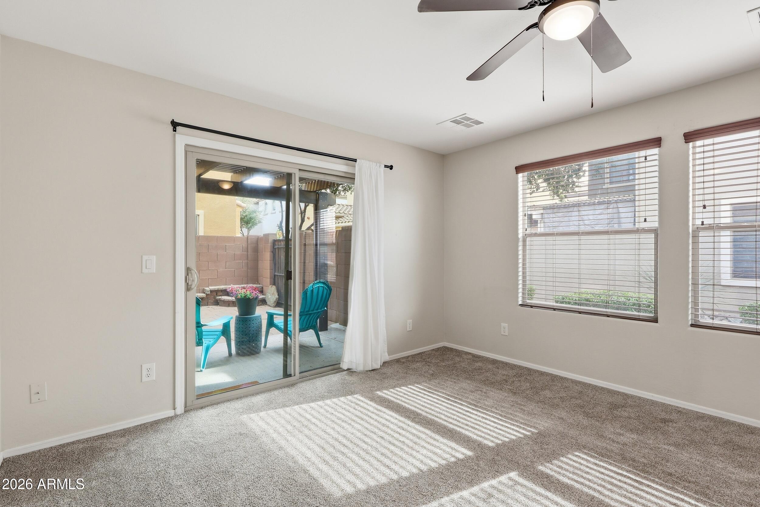 1853 South Balboa Drive Gilbert, AZ 85295 - Photo 7 of 32 a view of a room with wooden floor and windows