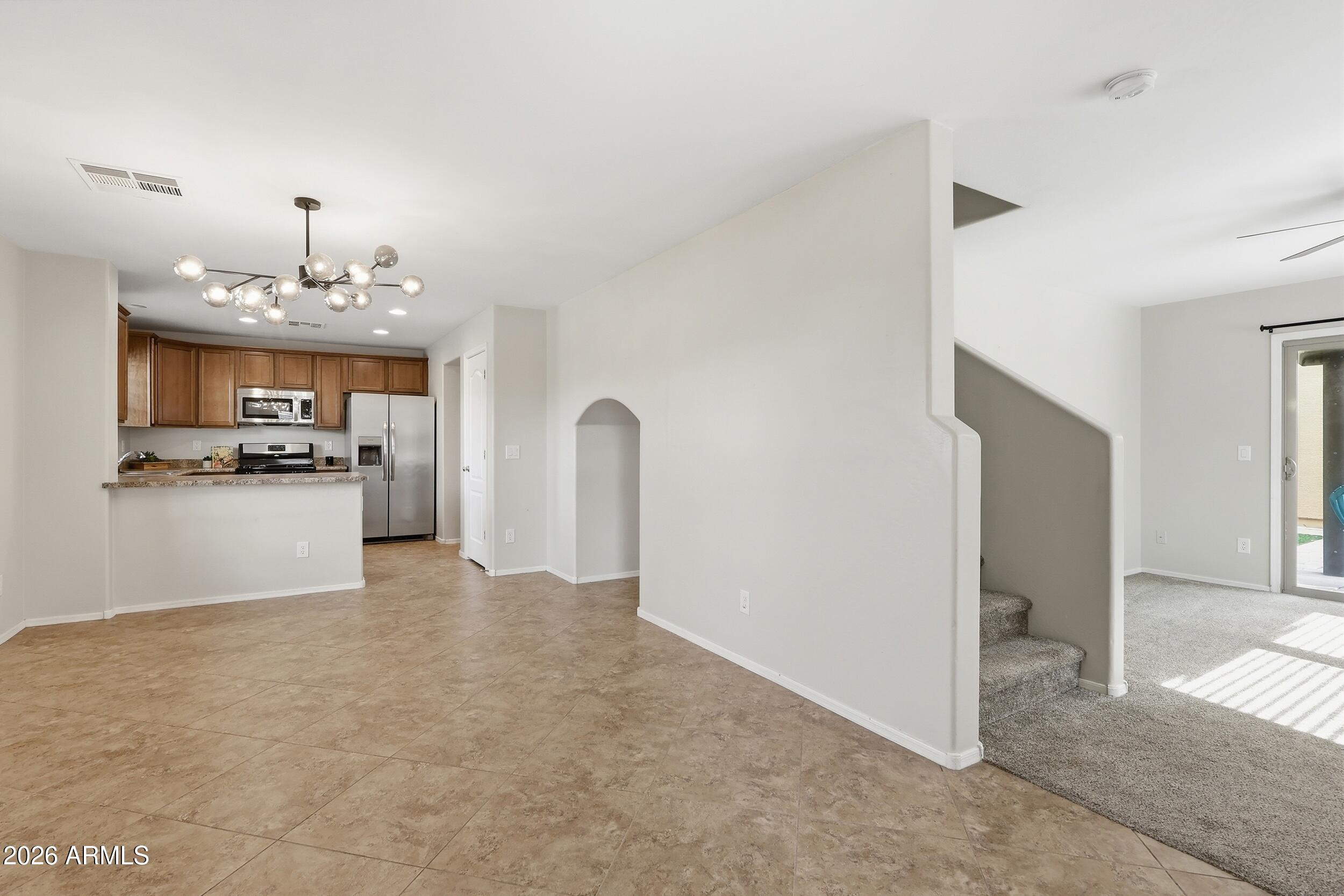 1853 South Balboa Drive Gilbert, AZ 85295 - Photo 10 of 32 a view of a kitchen with a sink and a refrigerator