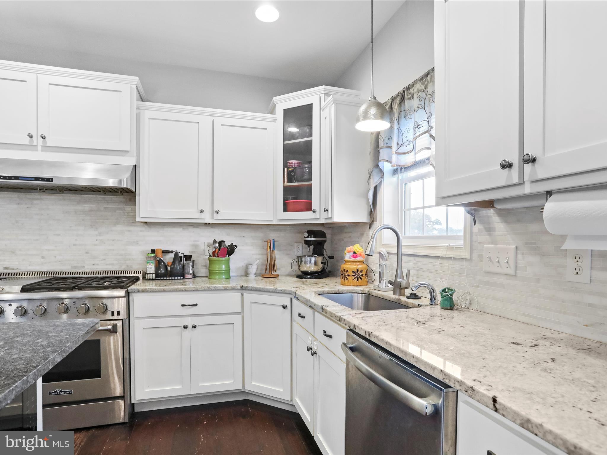 1699 Wind Flower Road, Unit 59 Chambersburg, PA 17202 - Photo 13 of 27 a kitchen with cabinets appliances a sink and a counter top space