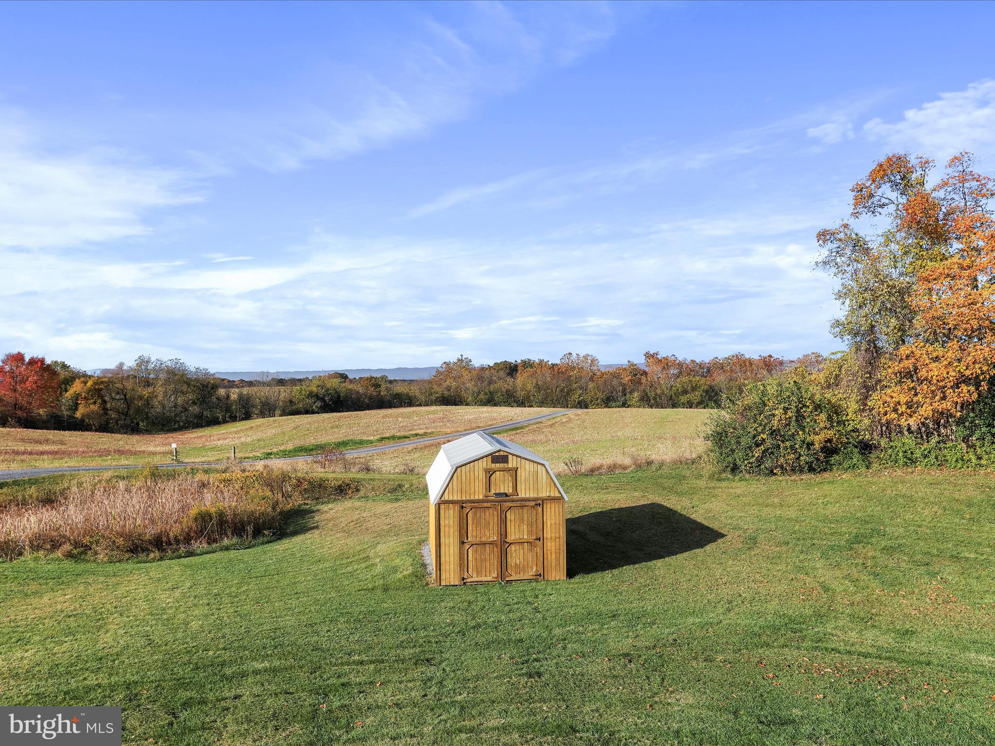 1699 Wind Flower Road, Unit 59 Chambersburg, PA 17202 - Photo 22 of 27 a view of a lake with a big yard