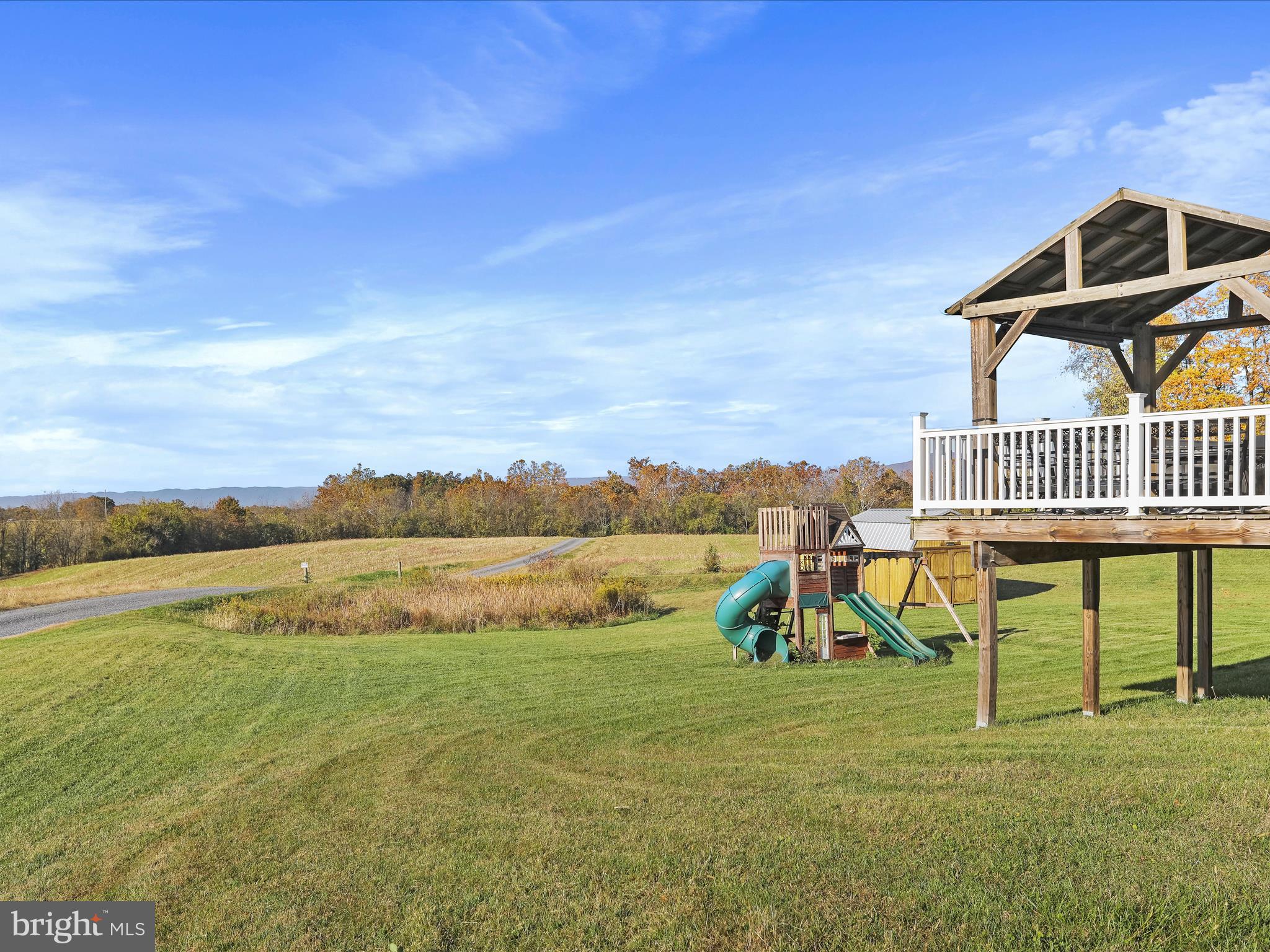 1699 Wind Flower Road, Unit 59 Chambersburg, PA 17202 - Photo 24 of 27 a view of a lake with a garden