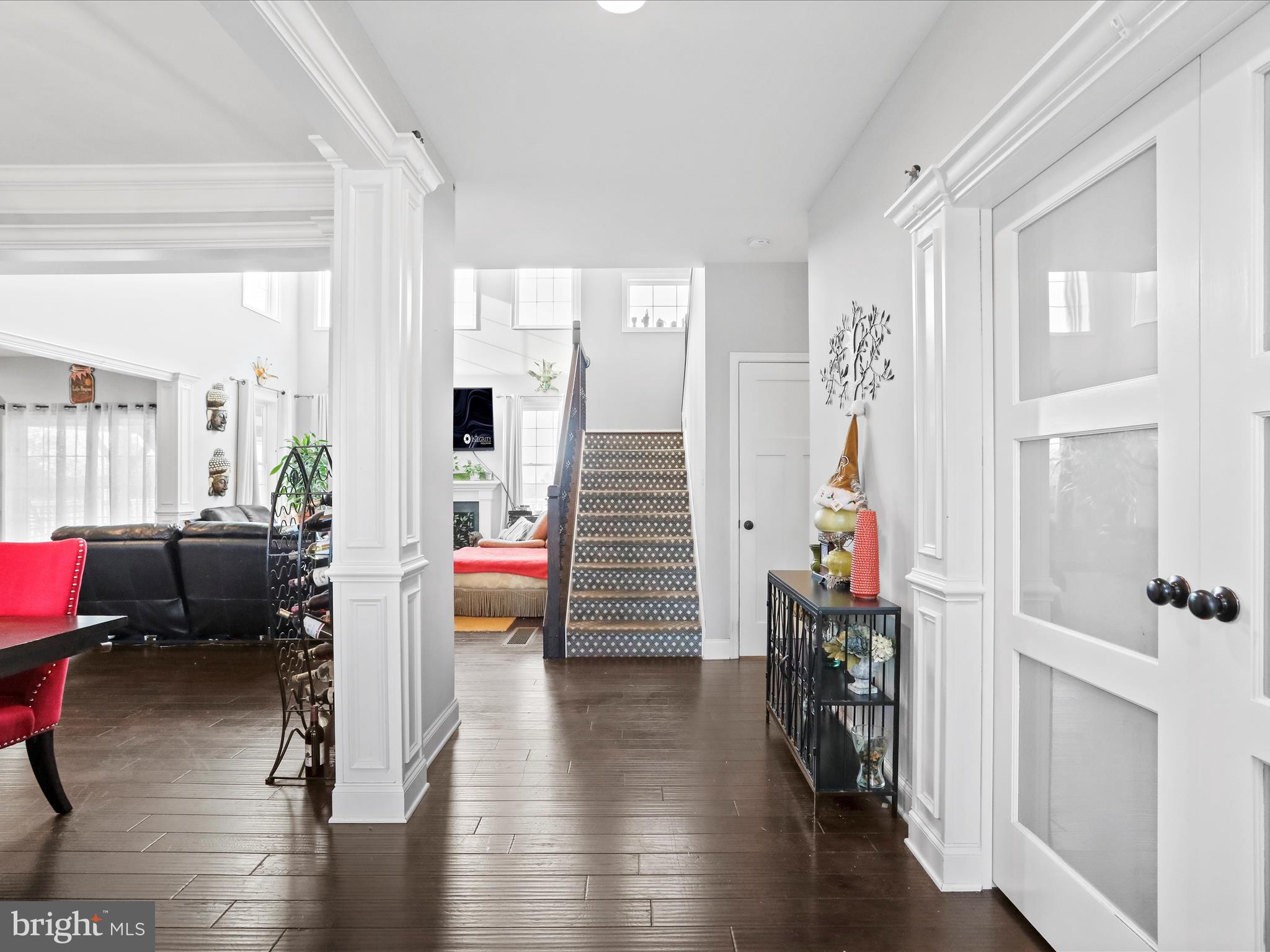 1699 Wind Flower Road, Unit 59 Chambersburg, PA 17202 - Photo 5 of 27 a hallway with wooden floor and furniture