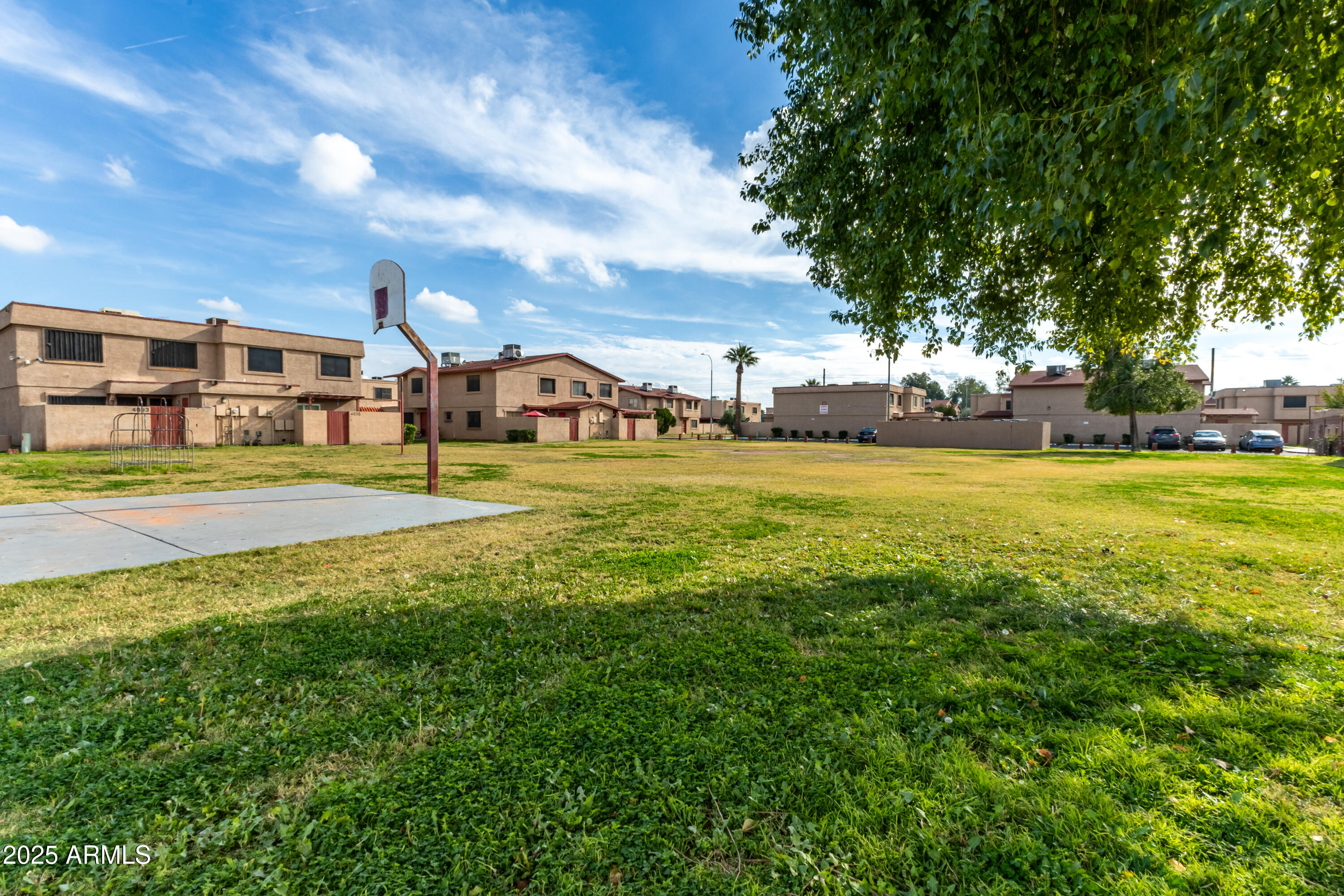 4107 West Wonderview Road Phoenix, AZ 85019 - Photo 12 of 13 a view of a big yard with palm trees