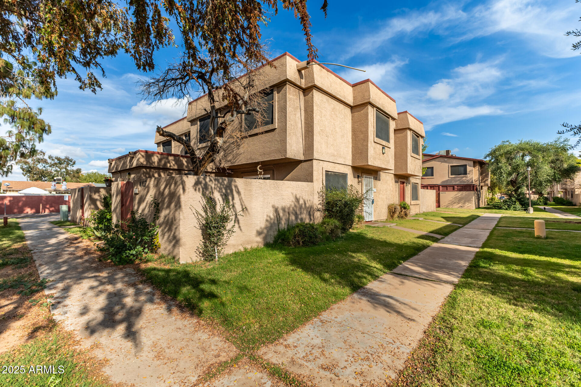 4107 West Wonderview Road Phoenix, AZ 85019 - Photo 2 of 13 a view of a house with a yard