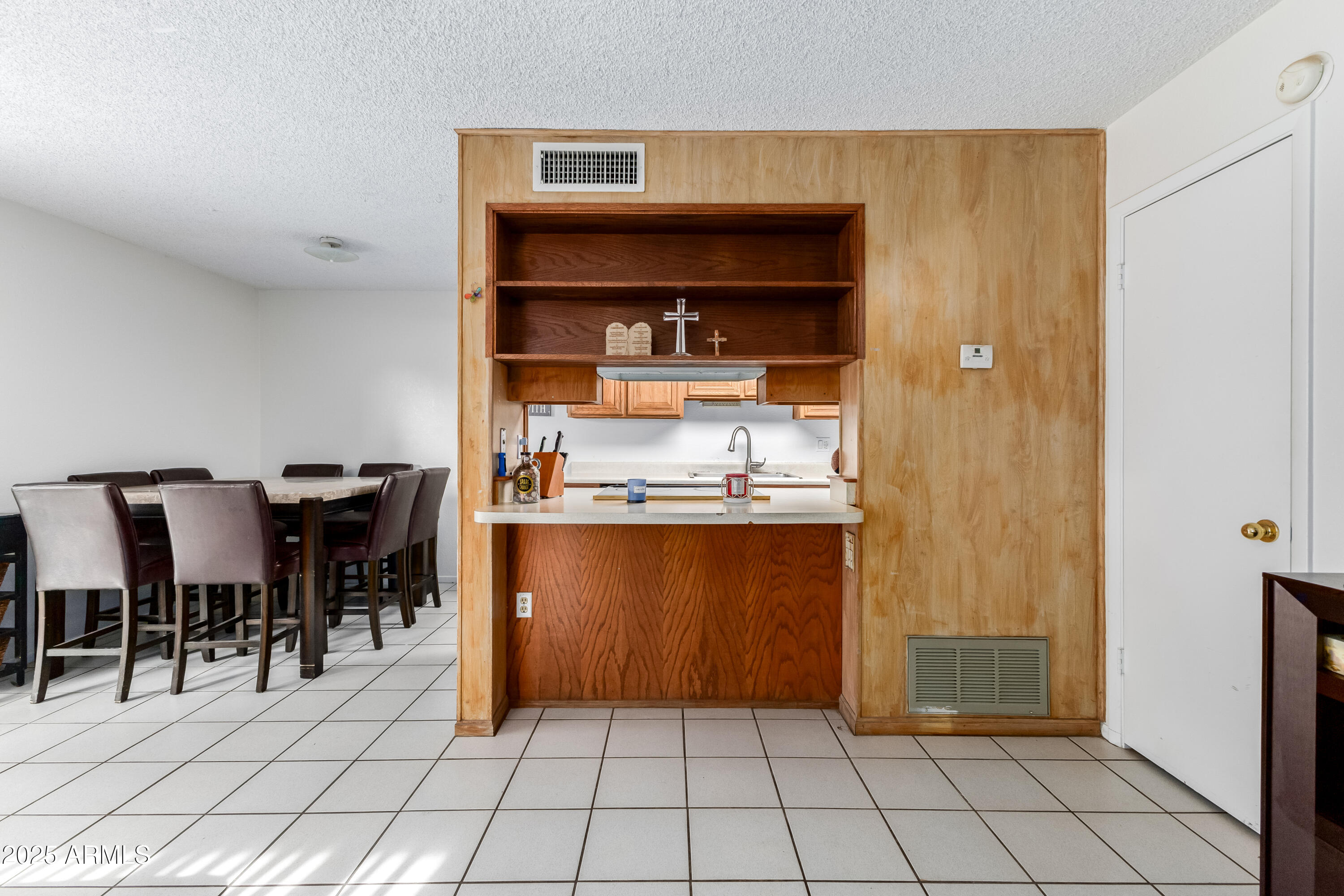 4107 West Wonderview Road Phoenix, AZ 85019 - Photo 5 of 13 a view of kitchen with refrigerator cabinets and outdoor counter