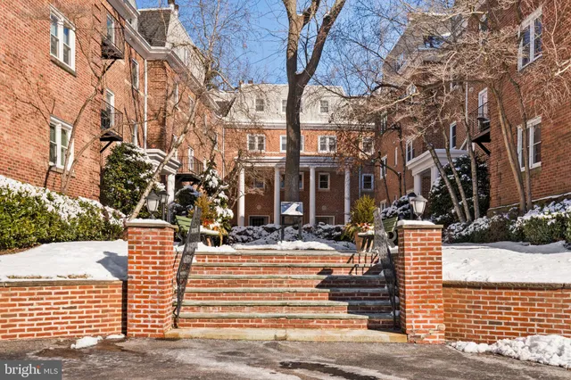 a view of a brick building with many windows