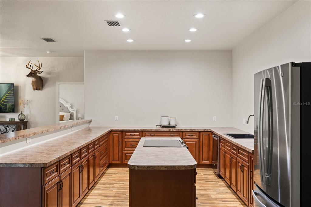 3865 Rabbit Run Road Wauchula, FL 33873 - Photo 12 of 43 a kitchen with a sink and refrigerator