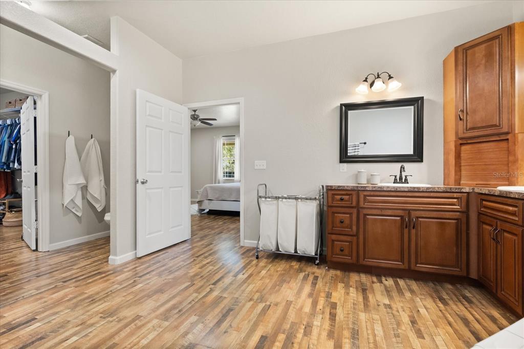 3865 Rabbit Run Road Wauchula, FL 33873 - Photo 20 of 43 a bathroom with a sink a mirror and a shower