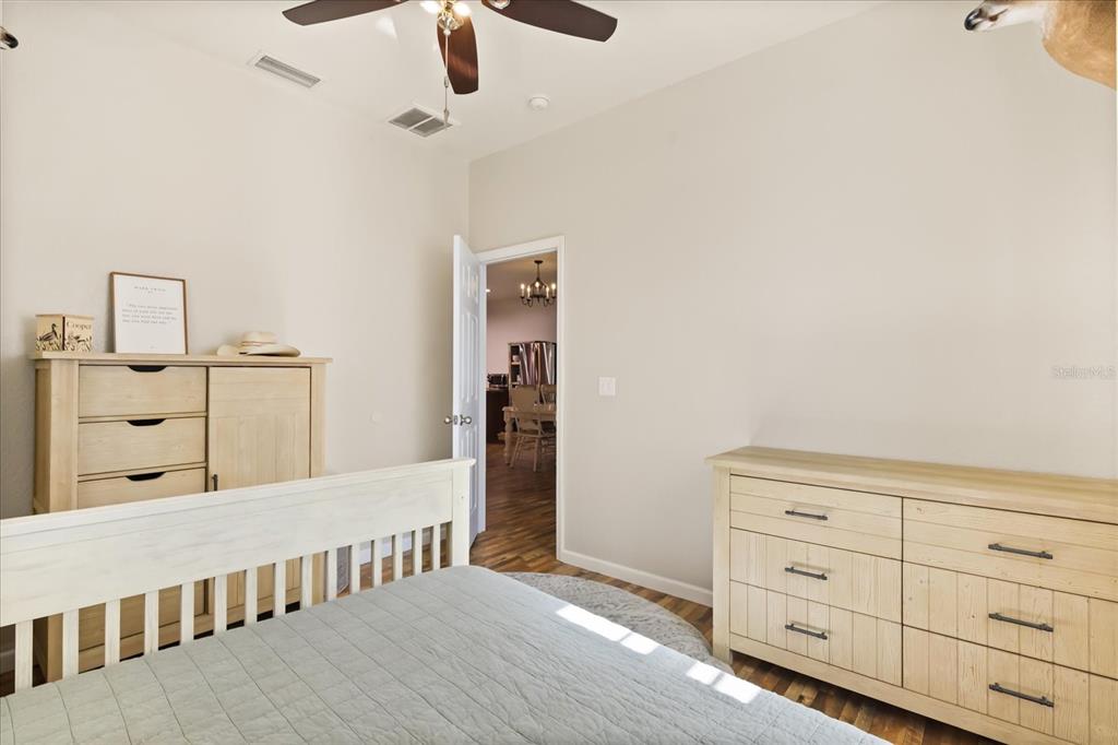 3865 Rabbit Run Road Wauchula, FL 33873 - Photo 22 of 43 a bedroom with furniture and wooden floor