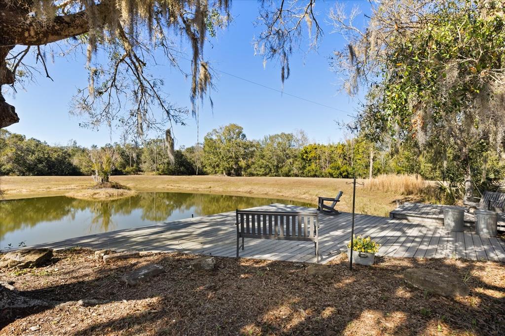 3865 Rabbit Run Road Wauchula, FL 33873 - Photo 32 of 43 a view of a lake with a yard and large trees