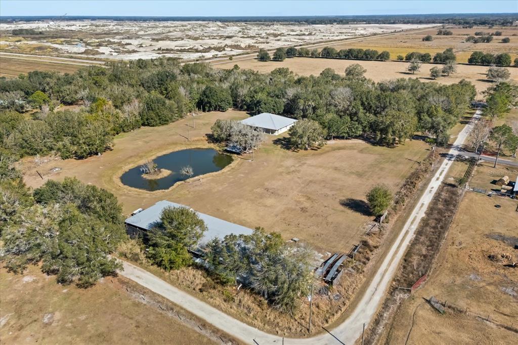 3865 Rabbit Run Road Wauchula, FL 33873 - Photo 34 of 43 an aerial view of a house with a yard and lake view