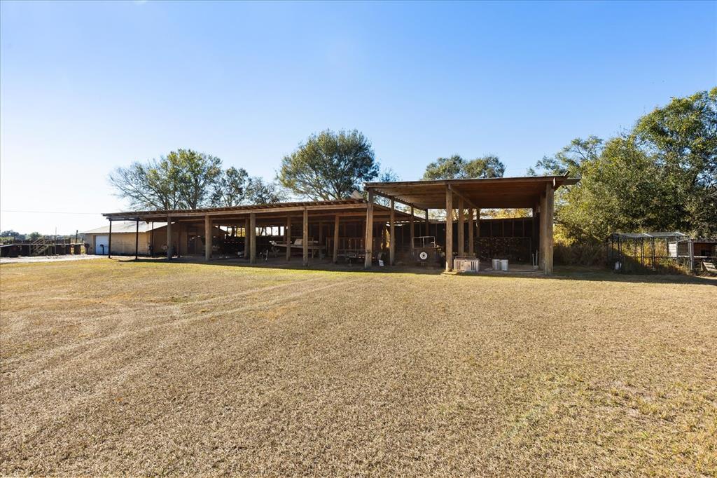 3865 Rabbit Run Road Wauchula, FL 33873 - Photo 36 of 43 a front view of house with yard and trees in the background