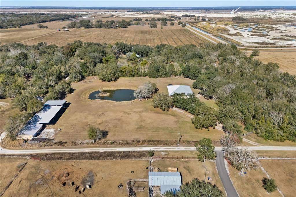 3865 Rabbit Run Road Wauchula, FL 33873 - Photo 40 of 43 an aerial view of residential houses with outdoor space
