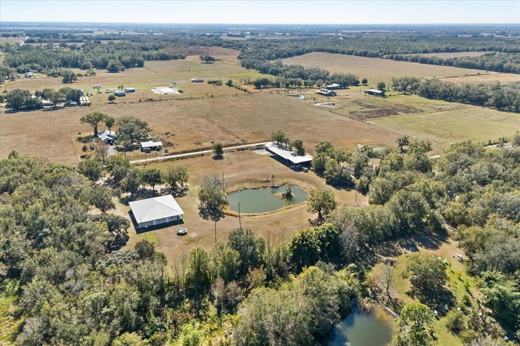 3865 Rabbit Run Road Wauchula, FL 33873 - Photo 42 of 43 an aerial view of residential houses with outdoor space and river