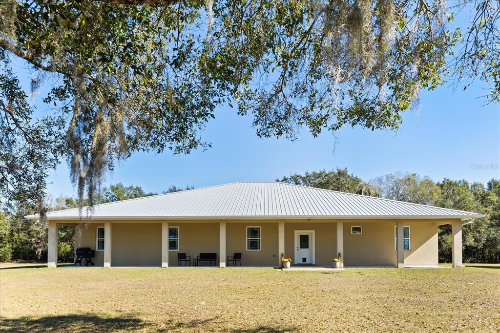 3865 Rabbit Run Road Wauchula, FL 33873 - Photo 43 of 43 front view of a house with a tree